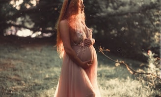 pregnant woman near tree