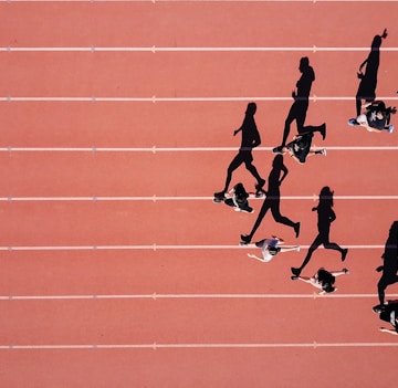 group of people running on stadium