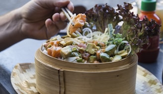 person eating with chopsticks