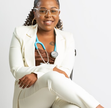 a woman in a white coat