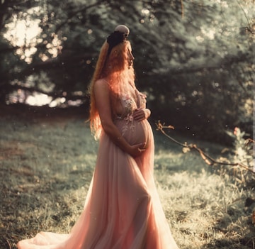 pregnant woman near tree