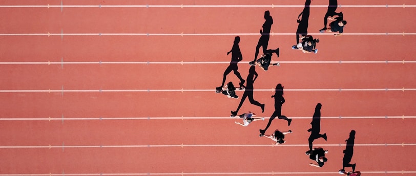 group of people running on stadium