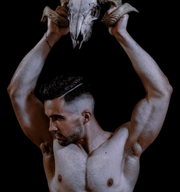 topless man with white wings