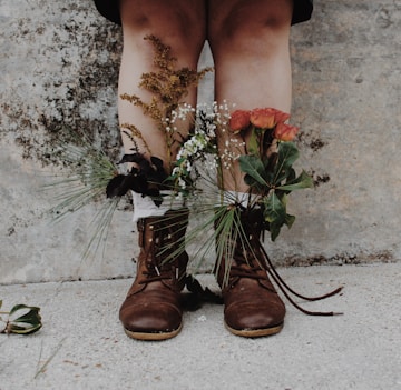 pair of brown leather boots