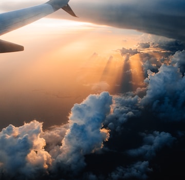 airplane on sky during golden hour