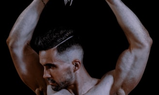 topless man with white wings