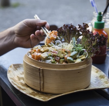 person eating with chopsticks