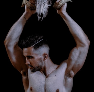 topless man with white wings