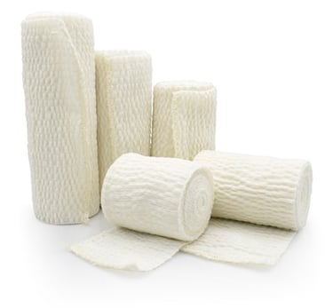 a group of white bandages and bandages on a white background